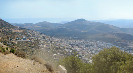 Aerial view from north mount Ari on south agriculture valley with old olive plantations. Middle East. Panoramic scene from lake of Kinneret to Mediterranean Sea and space for text on blue sky backdropの写真素材