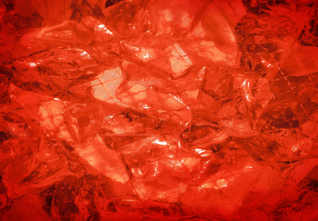 Glare glisten flame coquelicot rose color sulphate birthstone stack, mysterious lit by vivid hot carnelian coral glow. Close-up view with space for text on romantic refraction sparkle particle heapの写真素材