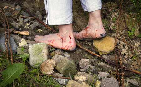 Ancient adult poor saint soul thorn cut skin bleed hurt ache crisis move history closeup view. Holy...