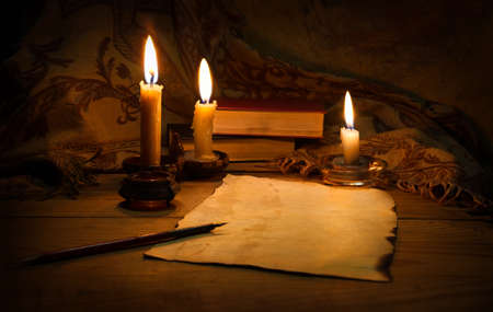 Brown age rag burnt holy christian god Christ bible torah law pad writer author dark black desk table nib post still life text space banner. Close up view diary notepad read literary art script scrollの写真素材