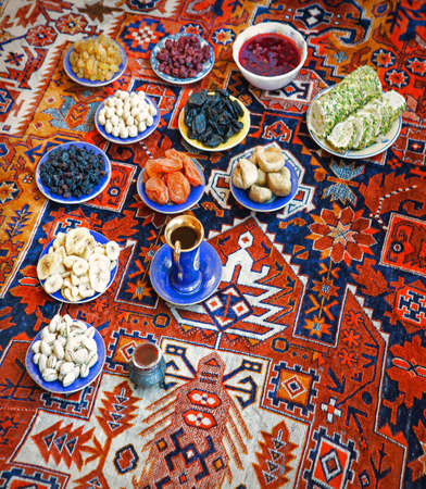 Variety tasty sugar mug date delight candy almond walnut grain seed heap bowl mix tea retro greet carpet texture text space. Closeup top view full holy eid health nutrit halva feast cafe party groupの写真素材