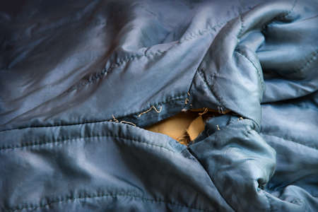 Close up abstract detail macro view bad rough dirt age cut crack hurt retro red color male youth wool fiber rag blank empty copy text space edge design. vintage shabby style second hand sleeve surfaceの写真素材