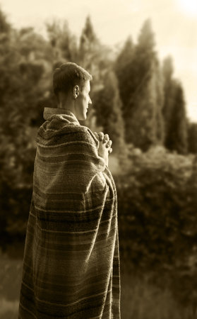 Happy joy peace humble ethnic bible male rabbi spirit rear side view sunny life hope middle eastern israeli guy hand ask beg thank scene. Asian robe tunic cloth old retro look grass sun light day skyの写真素材