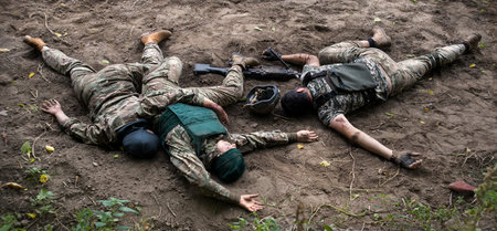 Nato lose guard troop male guy pain mine gun shot end protect life trauma remain fight fall dark field earth Mass danger scary horror aid suffer medic shell shock hero corpse arm lay hurt hide conceptの写真素材