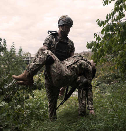 Brave USA nato navy force unit armed guard male guy hand gun shot hurt protect hope pray blood pain ptsd danger life fight fire dark forest tree field. Human aid prayer young girl hero stress conceptの写真素材