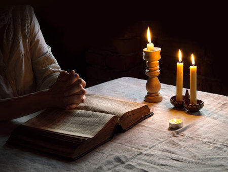 Bless hope human girl sacred thank ask Jesus Christ teach open new biblical paper page word text space. Retro young male guy boy student fold finger arm dark black night fire flame light Israel churchの写真素材