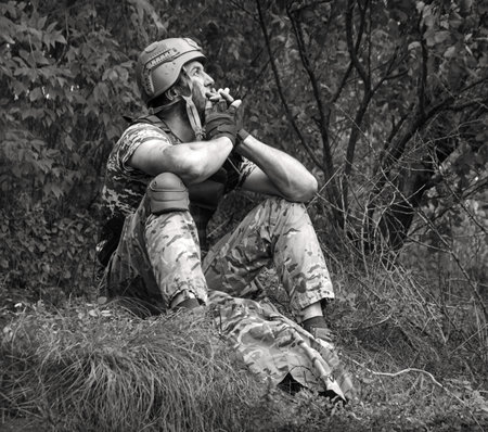Alone tired USA patriot navy unit male guy sit rest hand protect look hope pain post danger dark...