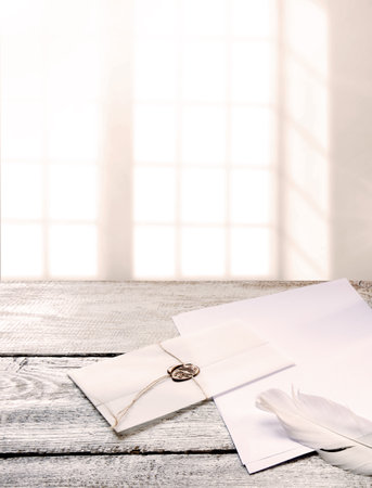 Closeup top view classic rustic age send notepad gift book tool art style sign symbol craft delivery. Grunge wax seal stamp rope tie tag close pack light worn table desk text space artist banner decorの写真素材