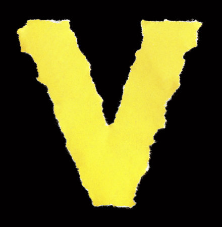 Multicolored letters of the Latin alphabet from torn scraps of colored paperの写真素材