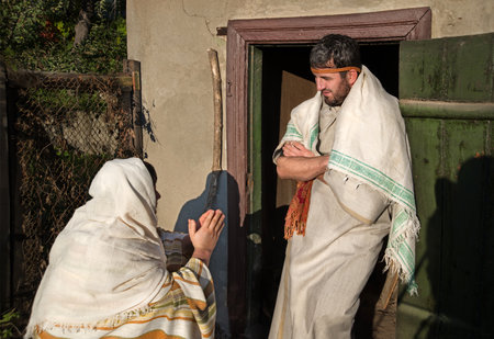 Old age jew kneel slave female girl prayer cry hand beg pray God job don't starve story. East cloth sad rich unjust male Arab debtor look not allow jobless rural social famine crisis law deny shelterの写真素材