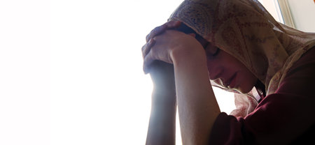 Young adult saint biblic lone tired lost fail mourn grief feel cry lady face ask beg Lord Jesus Christ hope Pious soul mental upset ill fear trust bible guilty pain old shawl dark black white sky textの写真素材