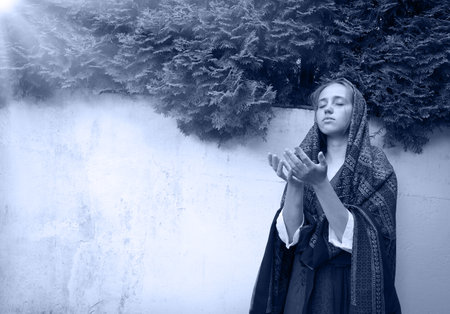 Holy sacred devot young Israeli Jew white old retro veil lady face ask beg plead wish Lord Jesus Christ. Broken fail crisis trouble upset teen spirit cry arm thank praise peace grace history park wallの写真素材