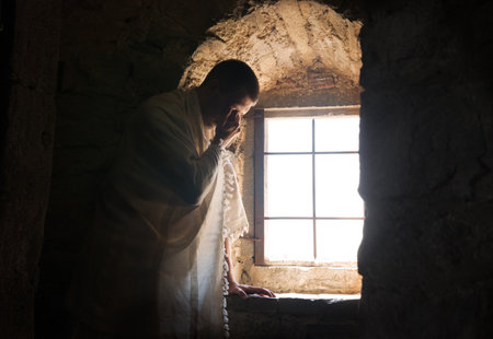 Solitude lone young adult east past age Jew guy faith sky holy monk hope. Worry sad upset sin think wish weep cry ask beg plead lord love forgive dark church jail prison home stone room symbol conceptの写真素材