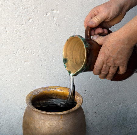 Retro holy girl pray lord god story bless tasty eastern Israel Galilee juice clay vase bowl bottle text space. Rustic rural east male human guy work alcohol cup pot food dinner symbolの写真素材