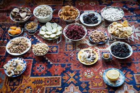 Many variety tasty sugar apricot cashew candy almond walnut heap bowl mix tea retro greet carpet texture text space. Closeup top view full health nutrit diet halva crop feast party group setの写真素材