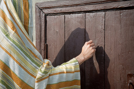 Close up retro rustic rural front dark black church visit adult age saint Peter ask arab open gate....