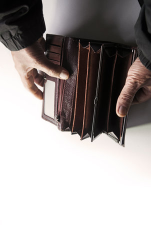 Closeup needy adult senior age guy arm dollar bill coin pouch bag case symbol. Close up top view...