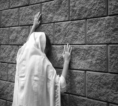 Misery lost bad worry feel mourn grief weep mood young lone holy teen lady Mary hand ask god faith hope. Old retro history biblic adult alone human male fail white islam veil templ home text spaceの写真素材