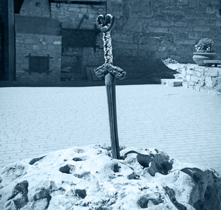 England city tower ruin outdoor danger town fort war battle sharp iron steel handle brave boy arm test yard place scenic view. Past royal dark middle age Britain army armor built myth saga sign sceneの写真素材