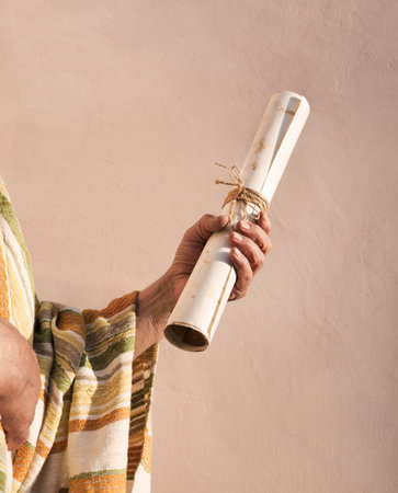 Closeup past holy god faith church hebrew biblic torah pray law text space concept. Young age devot believ jew male guy boy arm learn rustic worn blank note map roll rope ribbon seal label invite signの写真素材