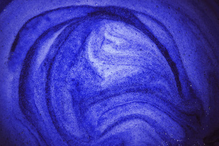 Close up macro bright cyan glow wet thick air round circle spiral fruit jam juice sauce spot stain element concept. art design dark juicy color soft spa oil gel sud lather spume text space top viewの写真素材