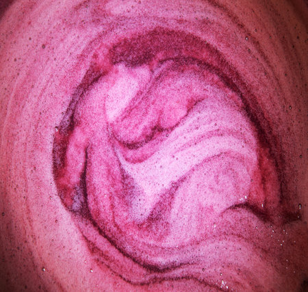 Close up macro bright light wet thick healthy sweet boil air round circle spiral spot stain drink meal concept. Past art design dark color fresh juicy soft spa oil gel sud spume text space top viewの写真素材
