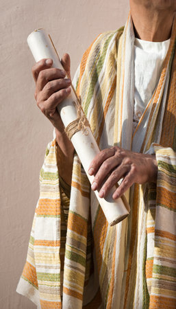 Closeup past holy faith church hebrew biblic torah pray law text space concept. Young age devot believ jew male guy boy arm learn rustic worn blank note map roll rope ribbon seal label invite signの写真素材