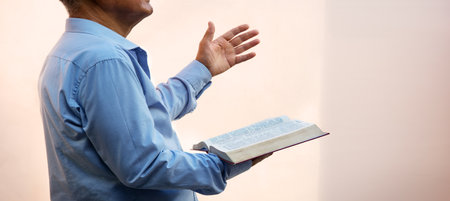 Sacred young saint devoted evangelic boy raise finger ask trust divine biblic love hope open new word page light white text space. Retro adult age guy arm historic urban city school street sin conceptの写真素材