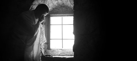 Solitude lone young adult east past age Jew guy faith sky holy monk hope. Worry sad upset sin think wish weep cry ask beg plead lord love forgive dark church jail prison home stone room symbol conceptの写真素材