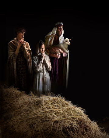 Cheer smile jewish guy come Lord boy kid crib life noel eve card dark black text space Old retro jew stable straw barn cave hand hold bring bless pray hope lamb scene new gospel church love star lightの写真素材