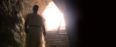 Dirty scary horror grunge egypt war army defense fort trap hall cell room stone wall ruin light glow. Gloomy stress fear captive victim male human fighter master step open black home black view releasの写真素材