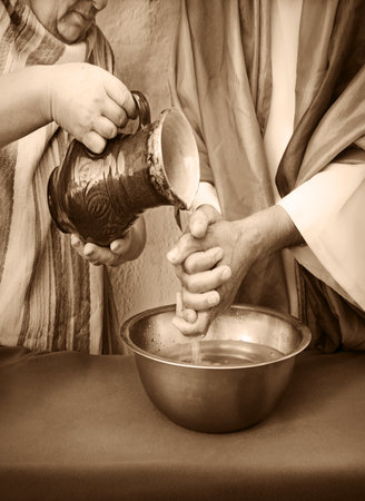 Closeup retro age east Israel jew temple god rite sign pitcher pour wet dirty guilt arm. Female maid...