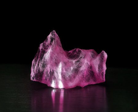 Bright elegant uncut rough old royal value druse mine ore ice facet lit icon sign. Close up view dark glamour magic gemmy rich gift reflect detail piece shape text space jewelery glow sparkle backdropの写真素材