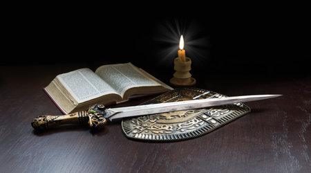 King age army paper page learn believ pray law steel iron metal sharp dark black table text space New sacred prayer spirit art gold military arm fire flame devot gospel scriptur worship life sign iconの写真素材
