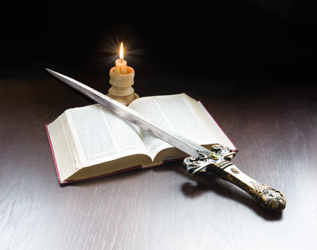 King age army paper page learn believ pray law steel iron metal sharp dark black table text space New sacred prayer spirit art gold military arm fire flame devot gospel scriptur worship life sign iconの写真素材