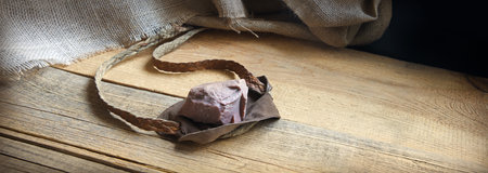 Close up detail macro view past age rough danger rubber hurt sport bullet aim lie blank tabl text space. Strong hunter male human person fun kid boy hand pull gun hobby biblic story conceptの写真素材