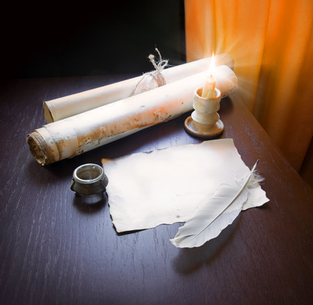 Grunge worn age holy author page dark black wood desk table still life banner. Closeup view hebrew...