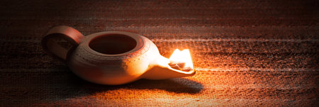 Closeup classic rural art middle arabian shiny kerosene jug jar vase burner wick blow table text space.の写真素材