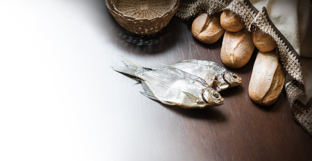 Raw rural box pita cake bakery pray bless retro Israel sign story. Close up view white human man boy towel catch dry sea supper still life dark black wooden table desk text spaceの写真素材