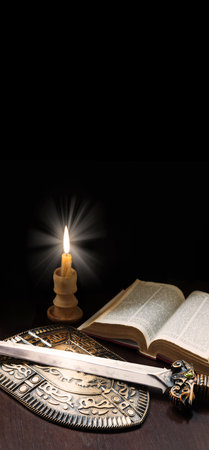 King age army paper page learn believ pray law steel iron metal sharp dark black table text space New sacred prayer spirit art gold military arm fire flame devot gospel scriptur worship life sign iconの写真素材