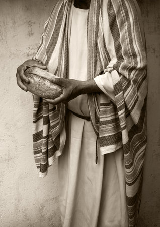 Tasty fresh good hot white barley grain bun crust help elder work care hungry girl kid Closeup chef male artisan arm faith break warm crusty rye diet cuisine retro home life text spaceの写真素材