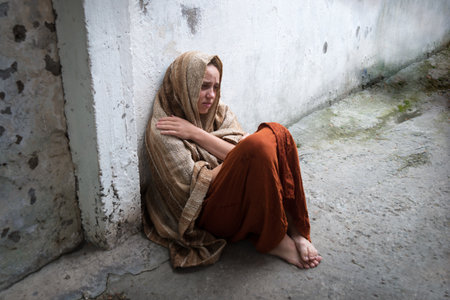 Misery lost lone cry prayer lone teen lady dirty urban street slum pray god help faith hope. Old...