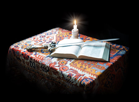 King age army read paper page learn believ bless pray hebrew law steel iron metal sharp dark black table text space. New culture sacred prayer spirit art gold flame military soldier arm life sign iconの写真素材