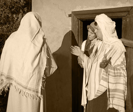 Jew age travel male beg plead don't want let room inn hotel home door East Asian arabic tunic robe cloth arab female girl Mary not deny reject refuse ban stay rural village street God xmas angel storyの写真素材