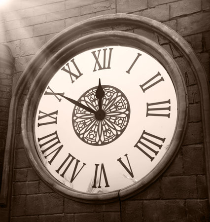 Closeup past age ornate large metal alarm world tick date count 12 art design Close up view dark...