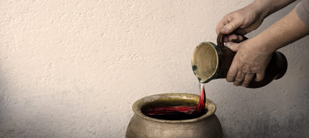 Retro holy Jew girl pray bible lord god story bless tasty eastern Israel Galilee juice clay vase bowl bottle text space. Rustic rural east male human guy master work alcohol cup pot food dinner symbolの写真素材