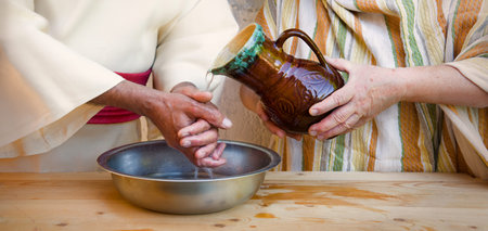 Closeup retro age east Israel jew temple god rite sign pitcher pour wet dirty guilt arm. Female maid...
