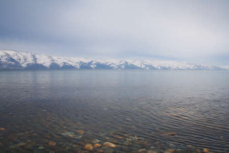 Lake in the mountains. Mountains in winter.