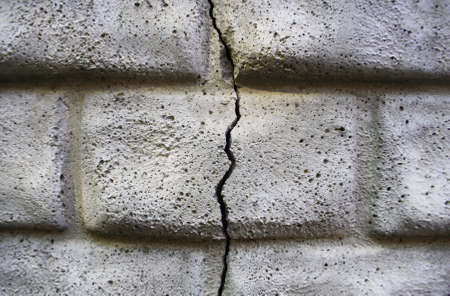 Brick wall. A crack in the wall. Background.の写真素材