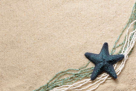 Background with blue seafish and beads for greeting cardの写真素材